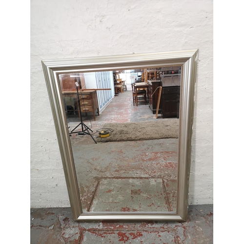 1146 - A modern silver framed bevelled edge wall mirror - approx. 95cm high x 132cm wide