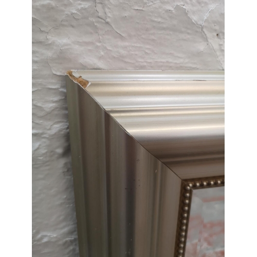 1146 - A modern silver framed bevelled edge wall mirror - approx. 95cm high x 132cm wide