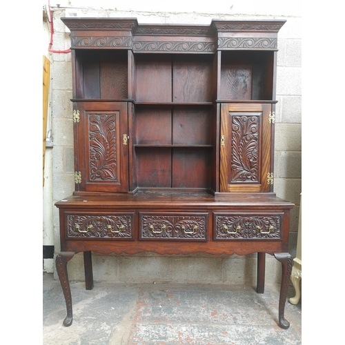 1147 - A late 19th/early 20th century carved oak dresser with two cupboard doors, upper plate rack, three d... 