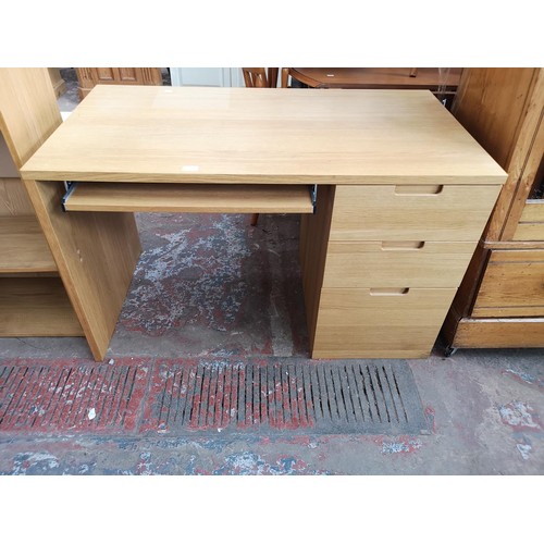 1098 - A modern oak effect office desk with three drawers and pull out tray - approx. 74.5cm high x 120cm w... 