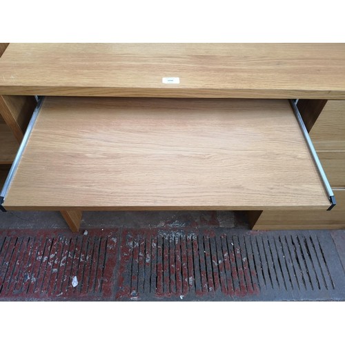 1098 - A modern oak effect office desk with three drawers and pull out tray - approx. 74.5cm high x 120cm w... 