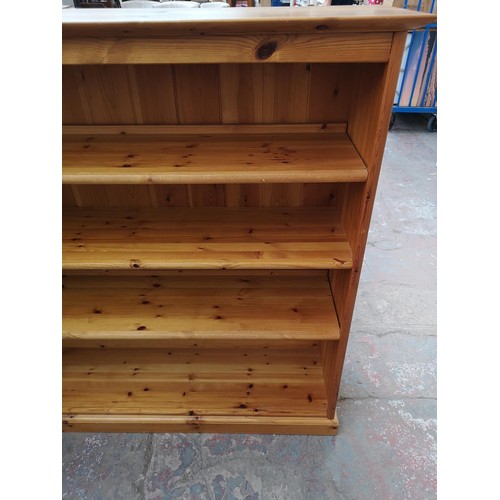 1095B - A modern pine four tier open bookcase - approx. 138cm high x 151cm wide x 39.5cm deep