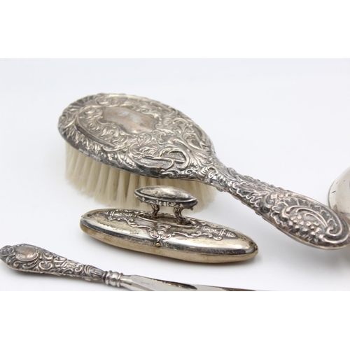 224 - Eight antique hallmarked .925 sterling silver ladies vanity items to include brushes, handled tools,... 