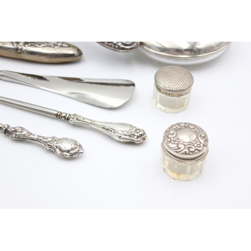 224 - Eight antique hallmarked .925 sterling silver ladies vanity items to include brushes, handled tools,... 