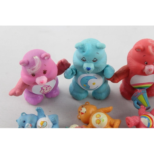 624 - Fifteen vintage Care Bear plastic toys