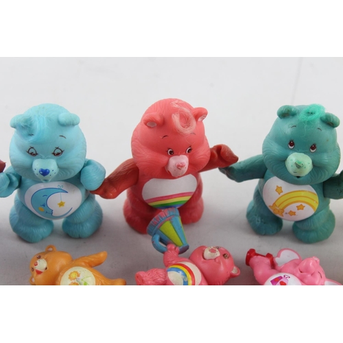 624 - Fifteen vintage Care Bear plastic toys