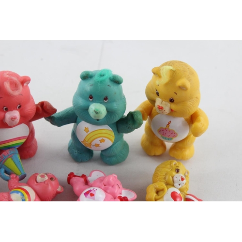 624 - Fifteen vintage Care Bear plastic toys