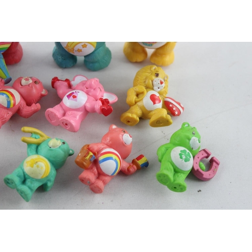 624 - Fifteen vintage Care Bear plastic toys