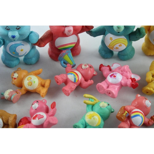 624 - Fifteen vintage Care Bear plastic toys