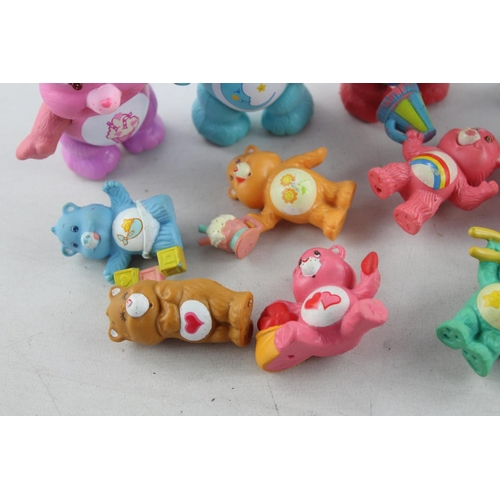 624 - Fifteen vintage Care Bear plastic toys