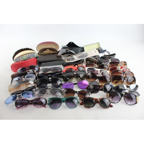 714 - A large collection of assorted sunglasses to include Calvin Klein, Lipsy London, Fabris Lane etc.