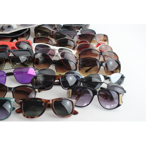 714 - A large collection of assorted sunglasses to include Calvin Klein, Lipsy London, Fabris Lane etc.