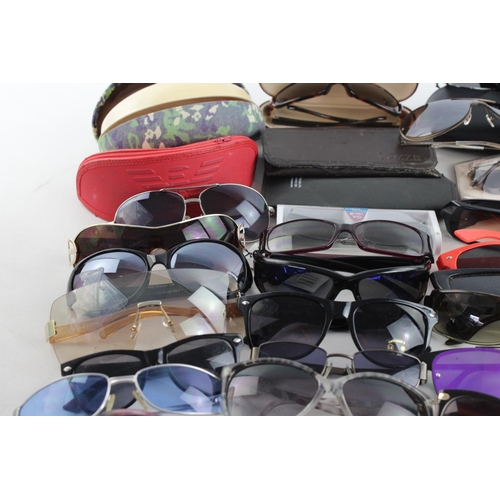 714 - A large collection of assorted sunglasses to include Calvin Klein, Lipsy London, Fabris Lane etc.