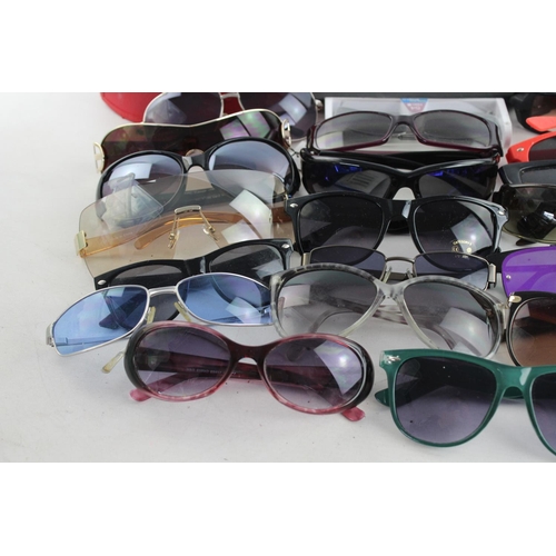 714 - A large collection of assorted sunglasses to include Calvin Klein, Lipsy London, Fabris Lane etc.