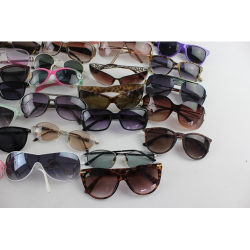 716 - A large collection of assorted pairs of sunglasses to include Jensen, Bloc, Fabris Lane etc.