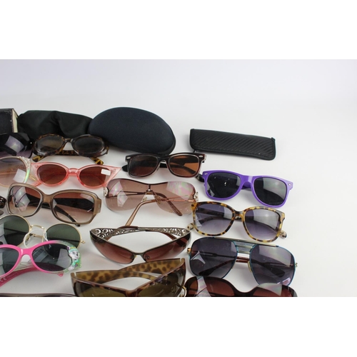 716 - A large collection of assorted pairs of sunglasses to include Jensen, Bloc, Fabris Lane etc.