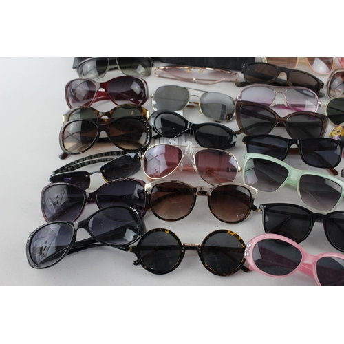 716 - A large collection of assorted pairs of sunglasses to include Jensen, Bloc, Fabris Lane etc.