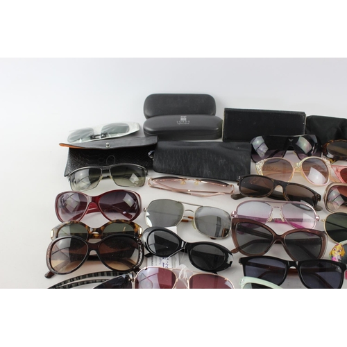 716 - A large collection of assorted pairs of sunglasses to include Jensen, Bloc, Fabris Lane etc.