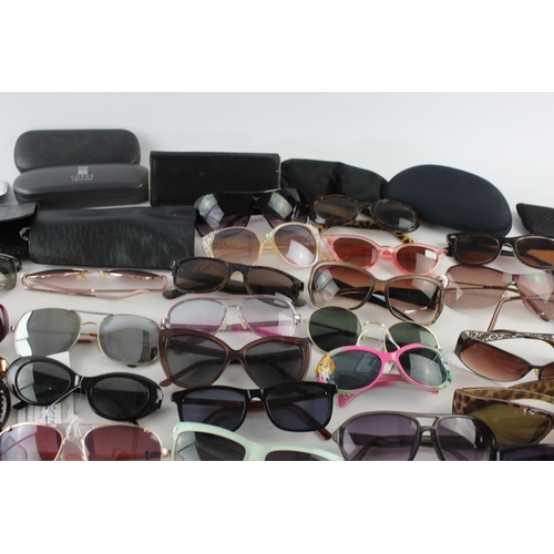 716 - A large collection of assorted pairs of sunglasses to include Jensen, Bloc, Fabris Lane etc.