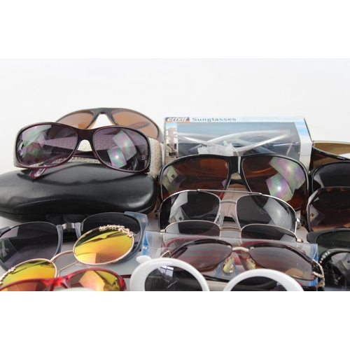 718 - A large collection of assorted sunglasses to include Storm, Firetrap, Maxmara etc.