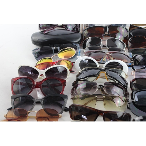 718 - A large collection of assorted sunglasses to include Storm, Firetrap, Maxmara etc.