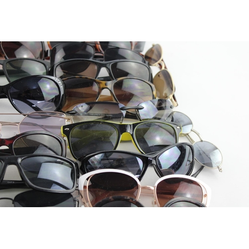 718 - A large collection of assorted sunglasses to include Storm, Firetrap, Maxmara etc.