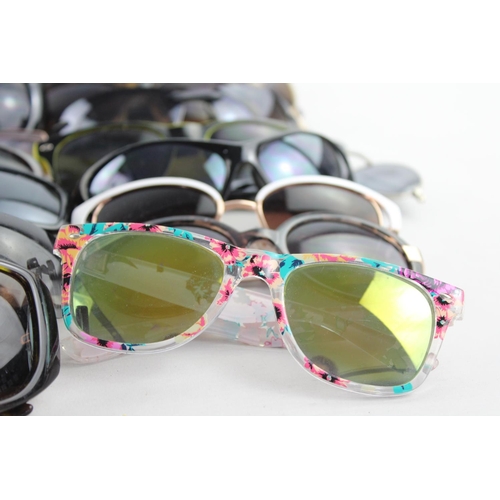 718 - A large collection of assorted sunglasses to include Storm, Firetrap, Maxmara etc.