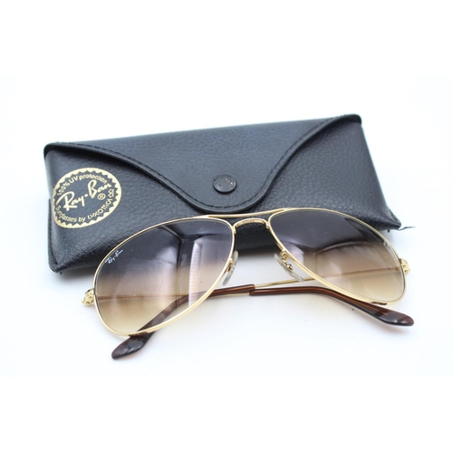 732 - A pair of cased vintage inspired Ray-Ban gold tone cockpit sunglasses