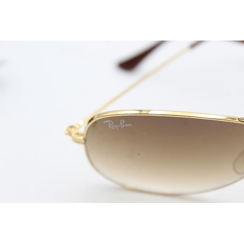 732 - A pair of cased vintage inspired Ray-Ban gold tone cockpit sunglasses