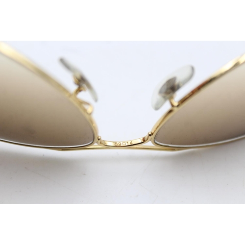 732 - A pair of cased vintage inspired Ray-Ban gold tone cockpit sunglasses