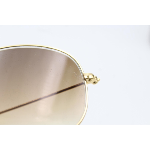 732 - A pair of cased vintage inspired Ray-Ban gold tone cockpit sunglasses