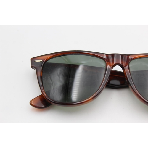 737 - A cased pair of vintage Bausch & Lomb Ray-Ban tortoiseshell effect Wayfarer II sunglasses