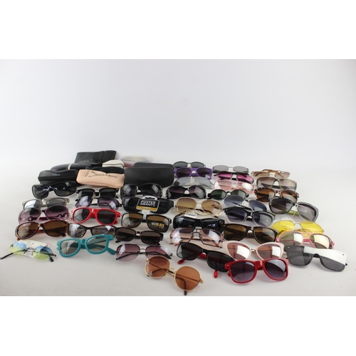 740 - A large collection of assorted pairs of sunglasses to include Bloc, Storm, Oakley etc.