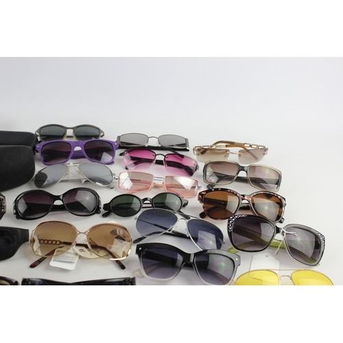 740 - A large collection of assorted pairs of sunglasses to include Bloc, Storm, Oakley etc.