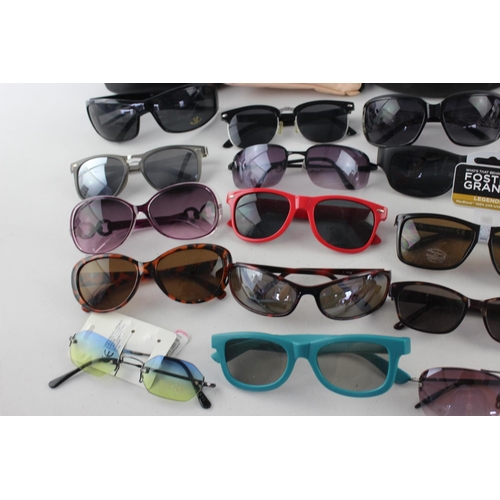 740 - A large collection of assorted pairs of sunglasses to include Bloc, Storm, Oakley etc.