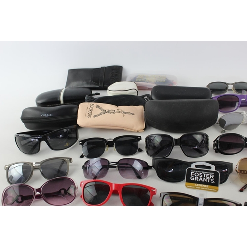 740 - A large collection of assorted pairs of sunglasses to include Bloc, Storm, Oakley etc.