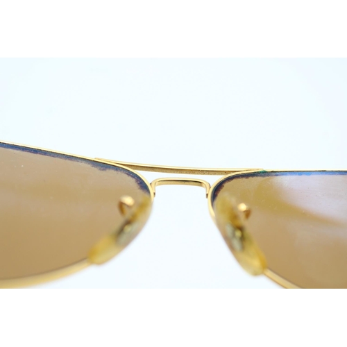 744 - A cased pair of vintage Bausch & Lomb Ray-Ban gold tone Aviator sunglasses