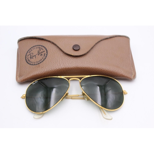 745 - A cased pair of vintage Bausch & Lomb Ray-Ban gold tone Aviator sunglasses