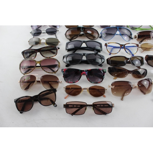 753 - A large collection of assorted sunglasses to include Miss Sixty, Roxy, Fabris Lane etc.