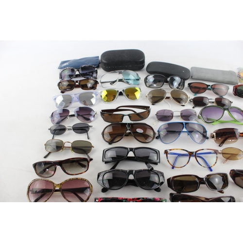 753 - A large collection of assorted sunglasses to include Miss Sixty, Roxy, Fabris Lane etc.