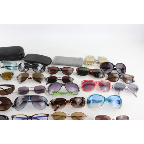 753 - A large collection of assorted sunglasses to include Miss Sixty, Roxy, Fabris Lane etc.