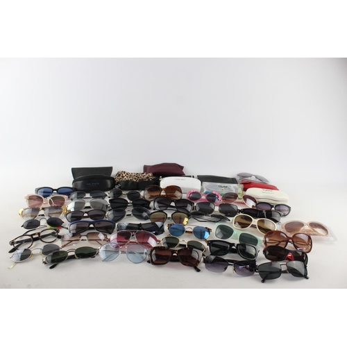 754 - A large collection of assorted pairs of sunglasses to include DKNY, Ted Baker, Nine West etc.