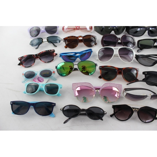 755 - A large collection of assorted sunglasses to include Hackett, Karen Millen, Police etc.