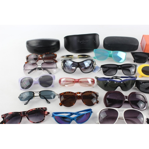 755 - A large collection of assorted sunglasses to include Hackett, Karen Millen, Police etc.