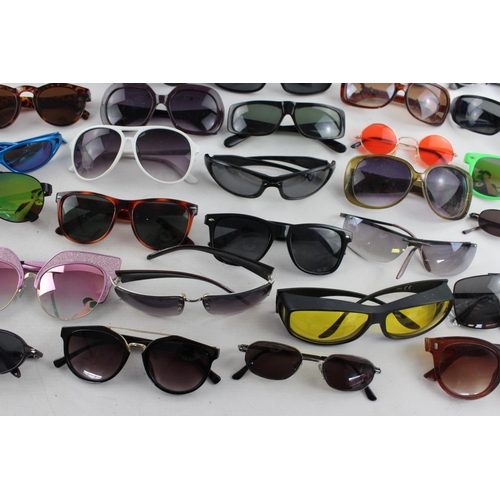 755 - A large collection of assorted sunglasses to include Hackett, Karen Millen, Police etc.