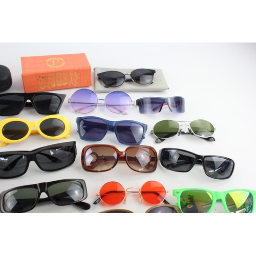 755 - A large collection of assorted sunglasses to include Hackett, Karen Millen, Police etc.