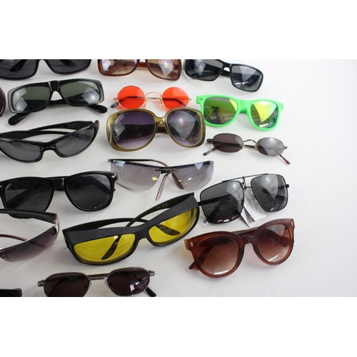 755 - A large collection of assorted sunglasses to include Hackett, Karen Millen, Police etc.