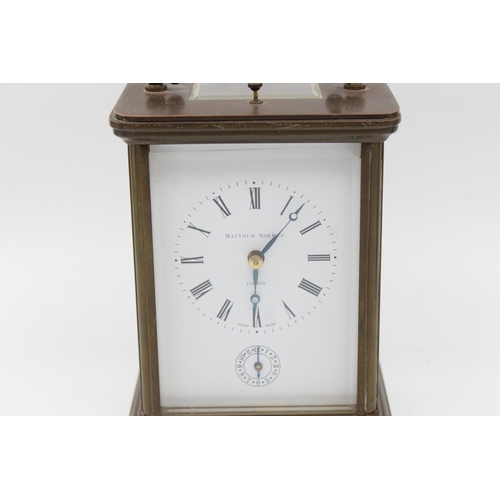 801 - A vintage Matthew Norman heavy brass cased key wind carriage clock with Swiss made 11 jewel movement... 