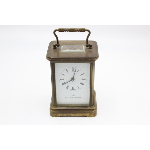 802 - A vintage Matthew Norman heavy brass cased  key wind carriage clock with eleven jewel movement