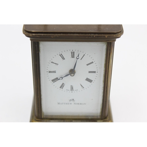 802 - A vintage Matthew Norman heavy brass cased  key wind carriage clock with eleven jewel movement